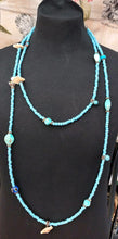 Load image into Gallery viewer, NECKLACE VERY LONG TURQUOISE COLOUR LITTLE BEADS + MOTHER OF PEARL CHIPS + BLUE GLASS EYES + MILLEFIORI MURANO GLASS BEADS

